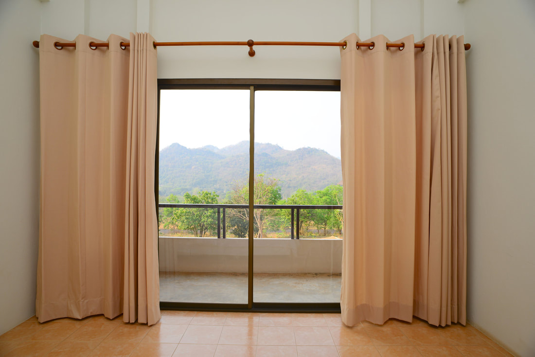 glass window with drapes